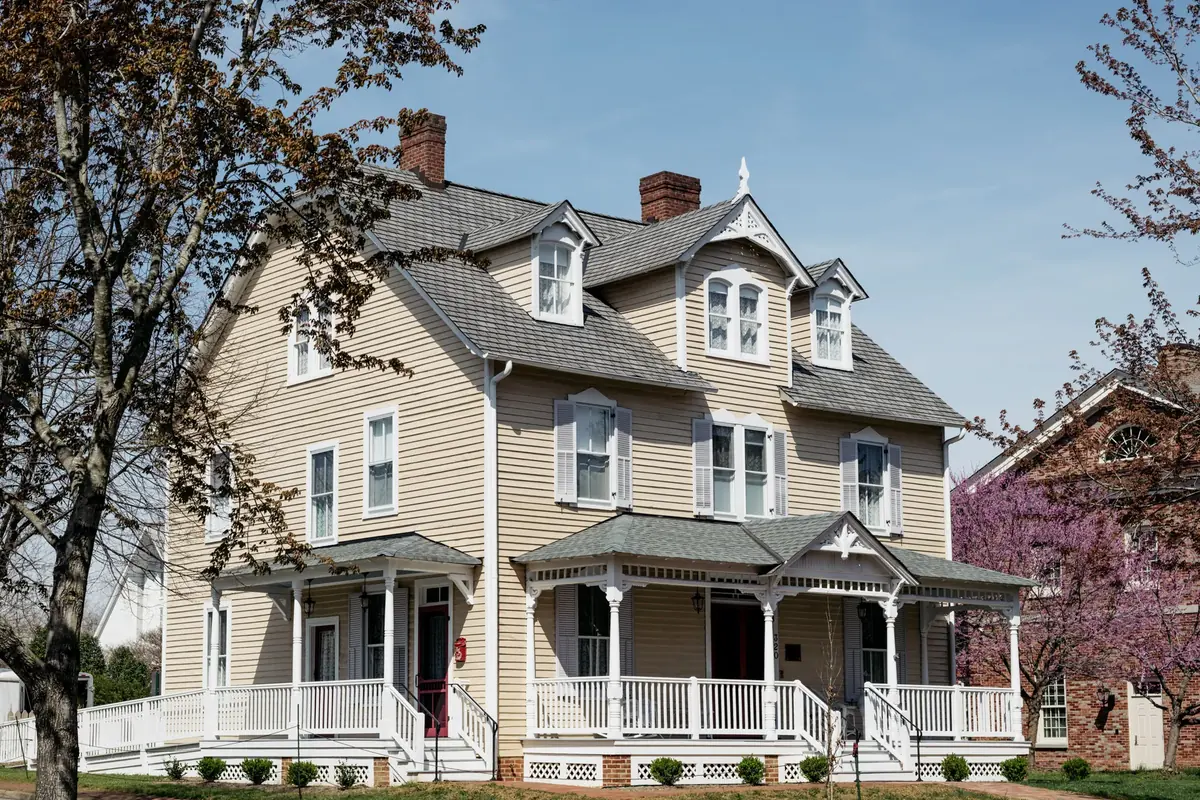 Armistead House exterior, restored 1890 Victorian inn with clapboard siding and wraparound porch, two blocks from Colonial Williamsburg