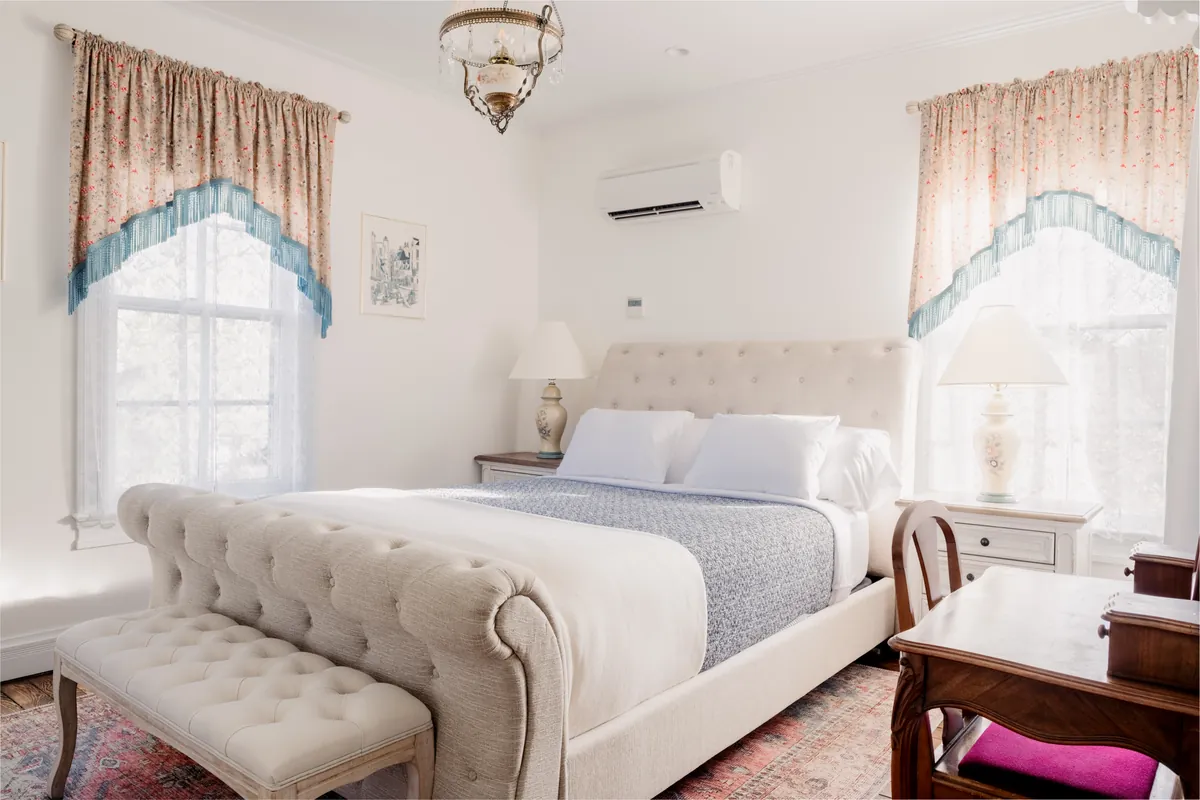 Shelley Room queen bed with natural light from two large windows